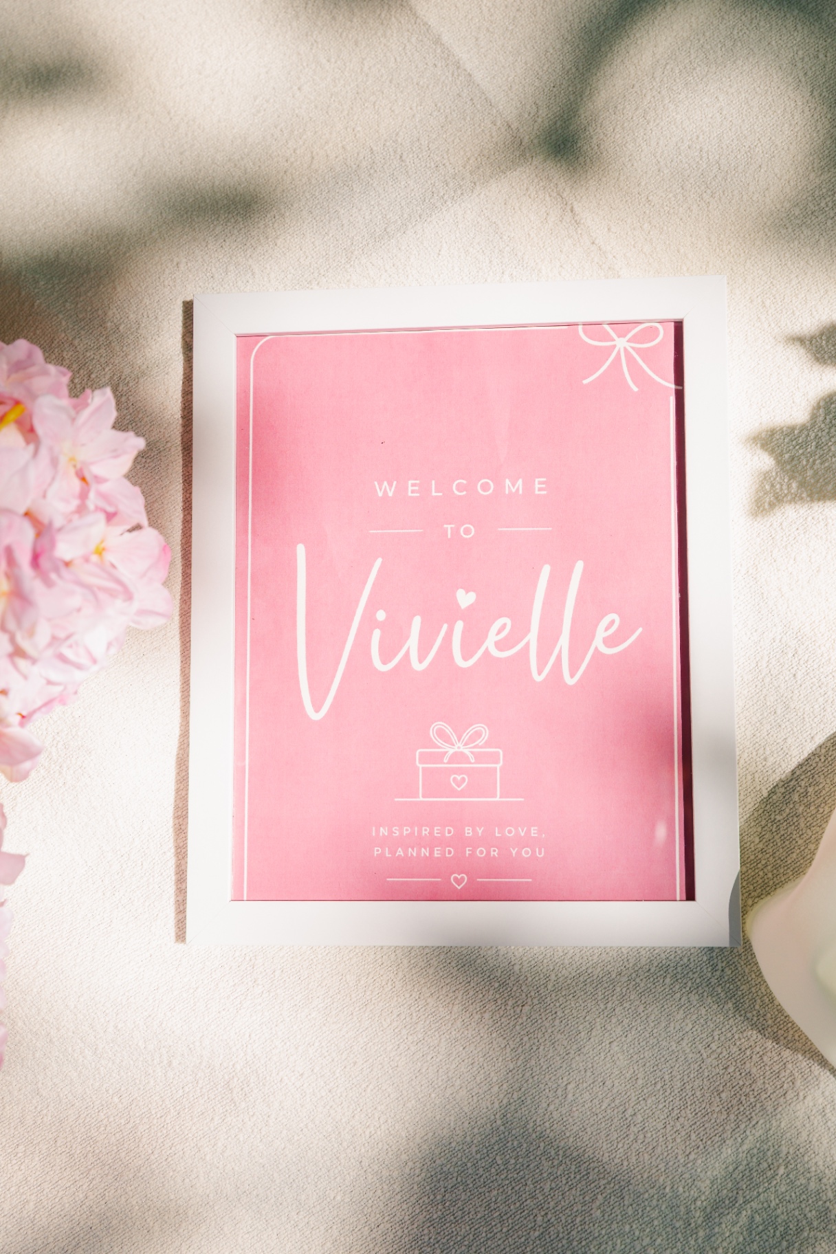 Vivielle Events welcome sign with cherry blossoms — premium event styling Budapest